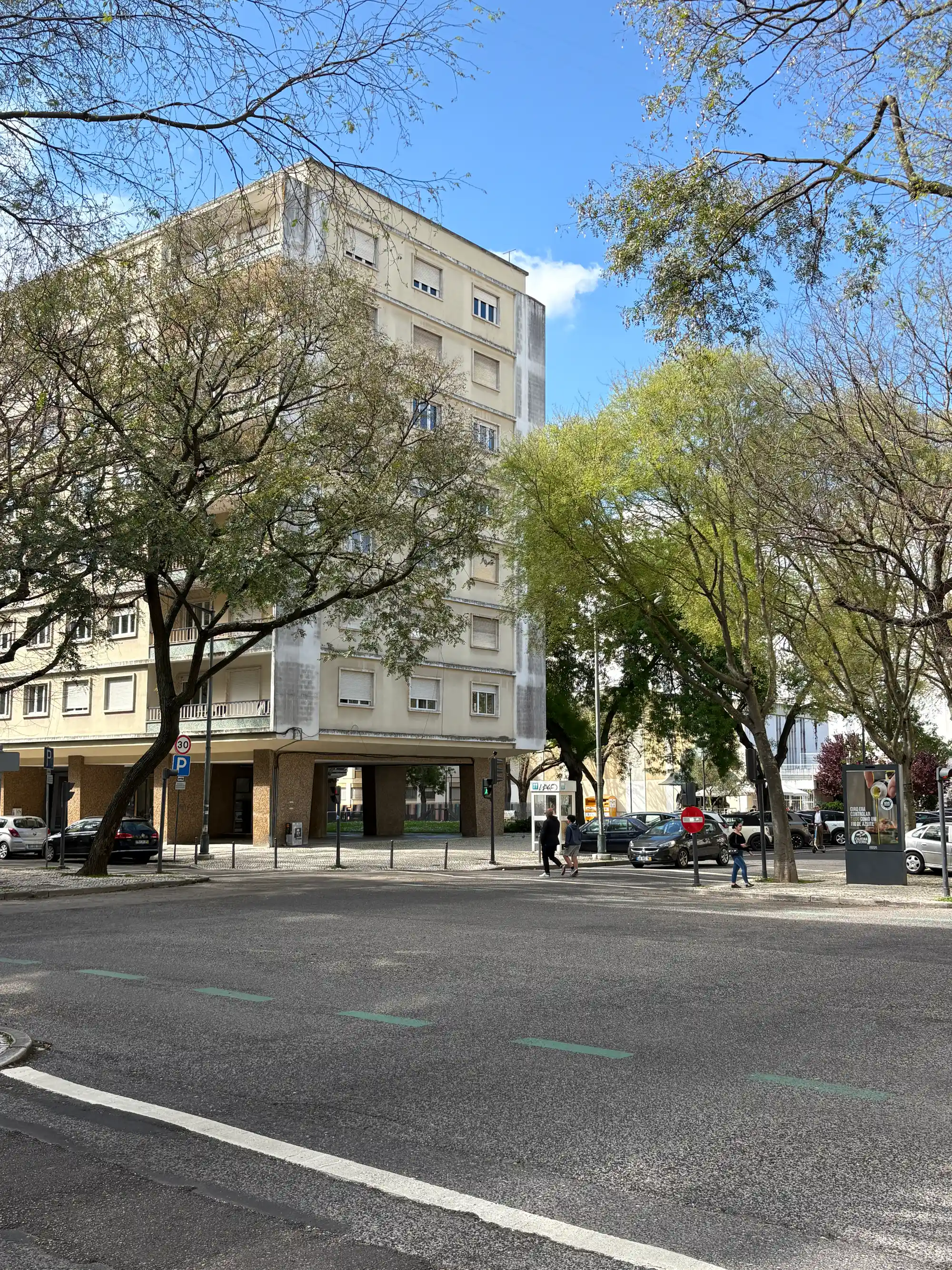 Modern office building and city street in Avenidas Novas, Lisbon, Portugal.