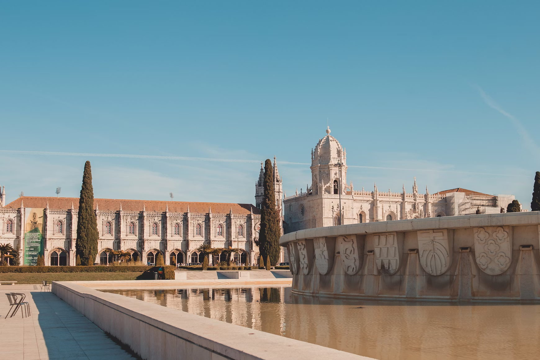 Belem: a large building with a fountain in front of it