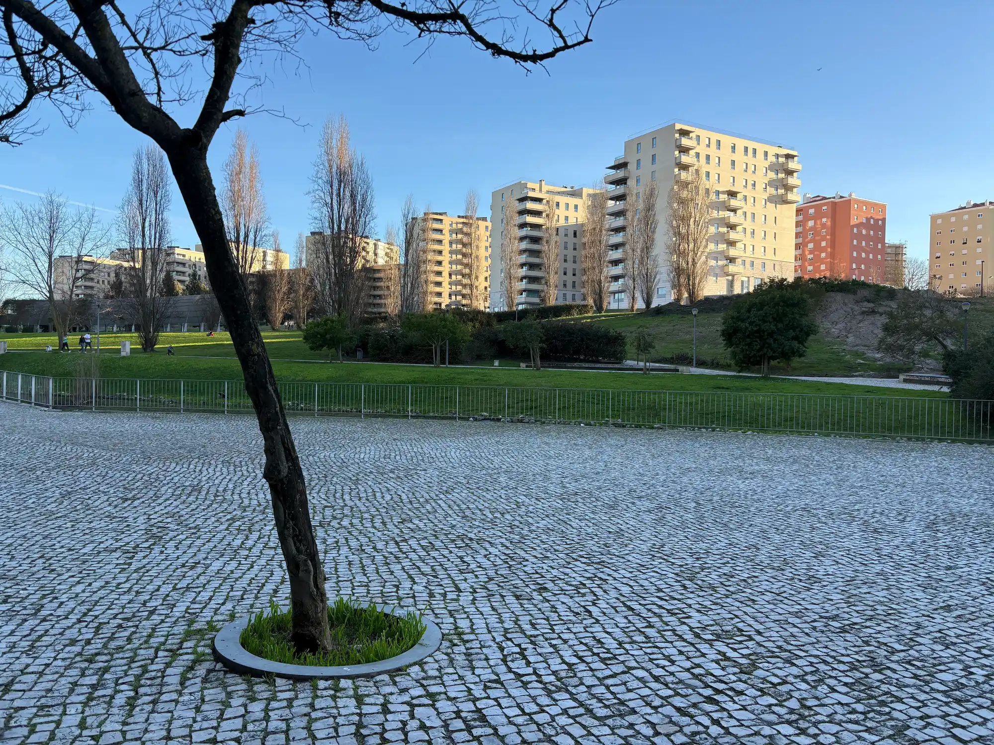 Santa Clara Lisbon residential area with green park, modern apartment buildings, and open urban space